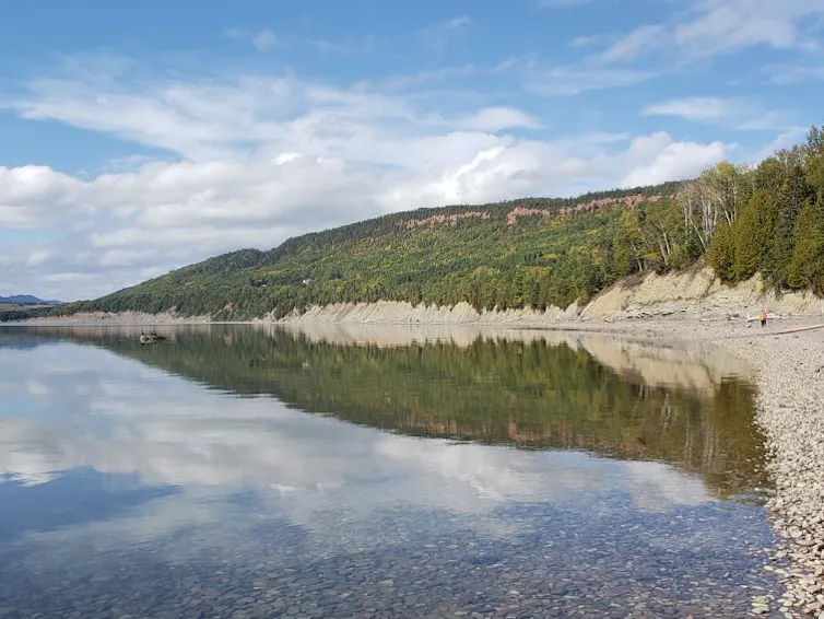 A photograph of a lake and cluffs