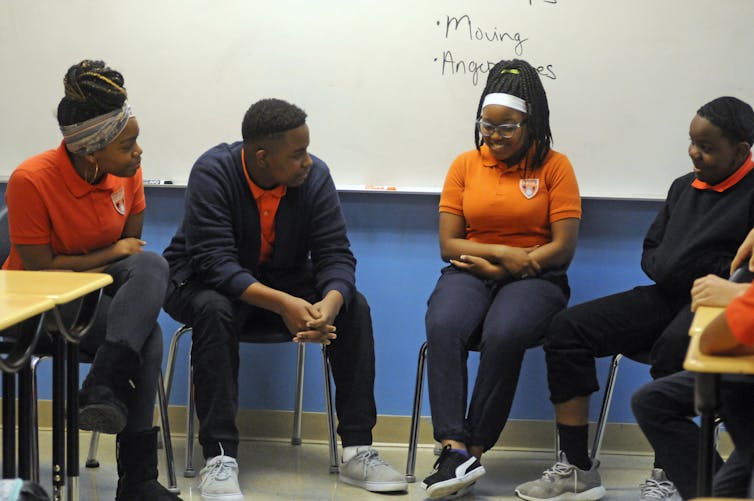 Students participate in an activity about mental health and suicide prevention at Uplift Hampton Preparatory School in Dallas.