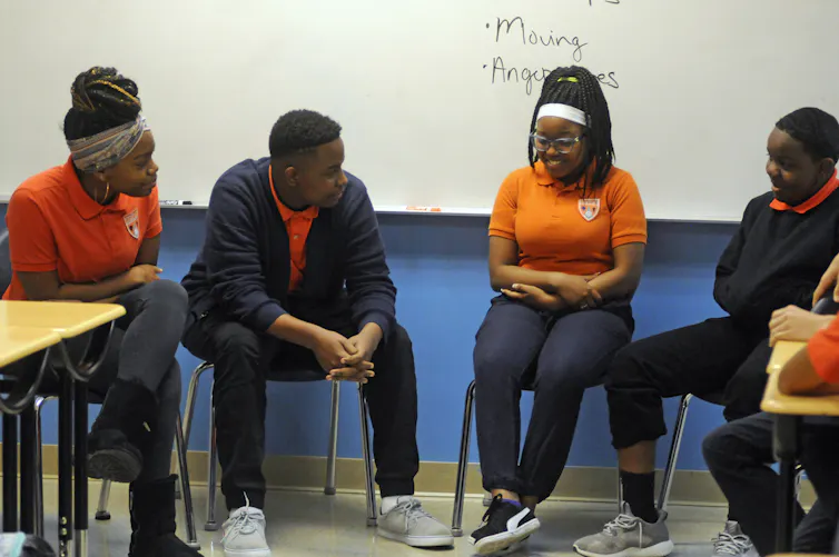 Students participate in an activity about mental health and suicide prevention at Uplift Hampton Preparatory School in Dallas.