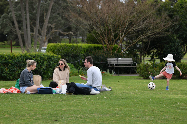 People picnic in a park