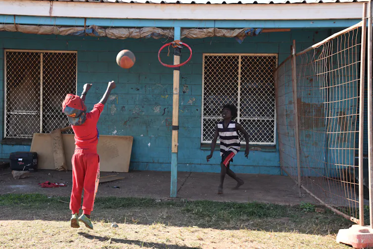 Children play basketball.