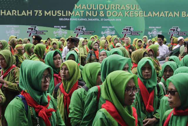 Indonesian Muslim women gather for the 73rd anniversary of the largest Muslim organization, the Nahdlatul Ulama.