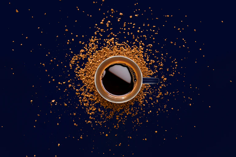 Aerial view of an espresso coffee and some coffee grinds