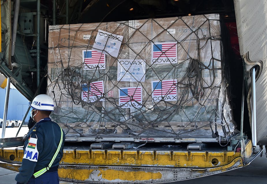 Boxes labeled with US flag in a cargo plane 