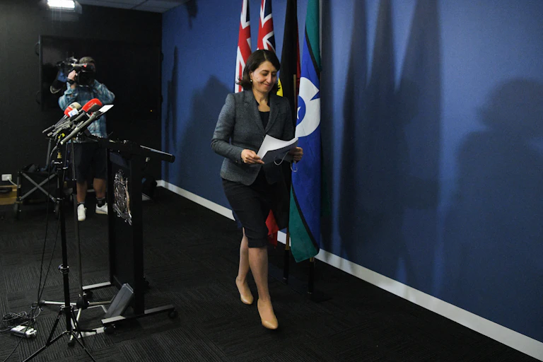 NSW premier leaving the stage at pressconference