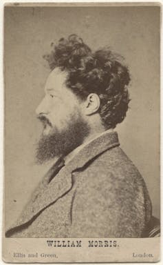Black and white profile photo of William Morris with dark hair and beard.