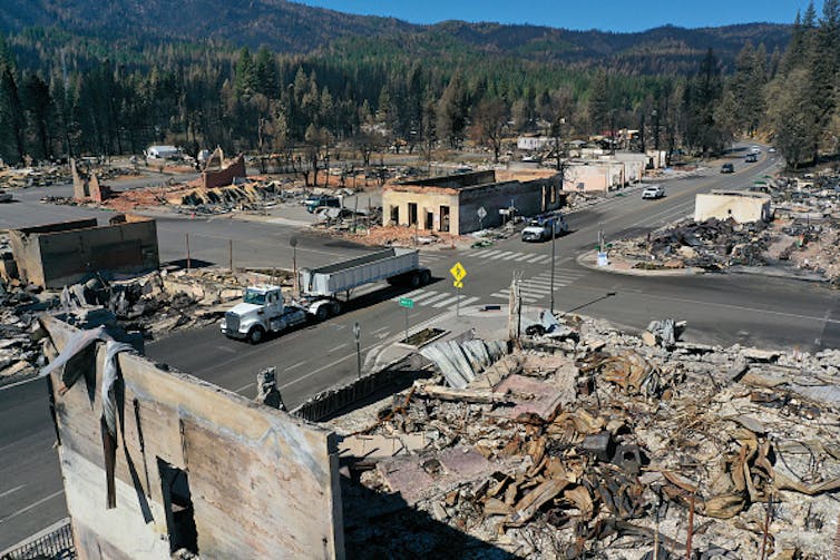 A few walls are standing, but most of the town is burned and melted rubble.