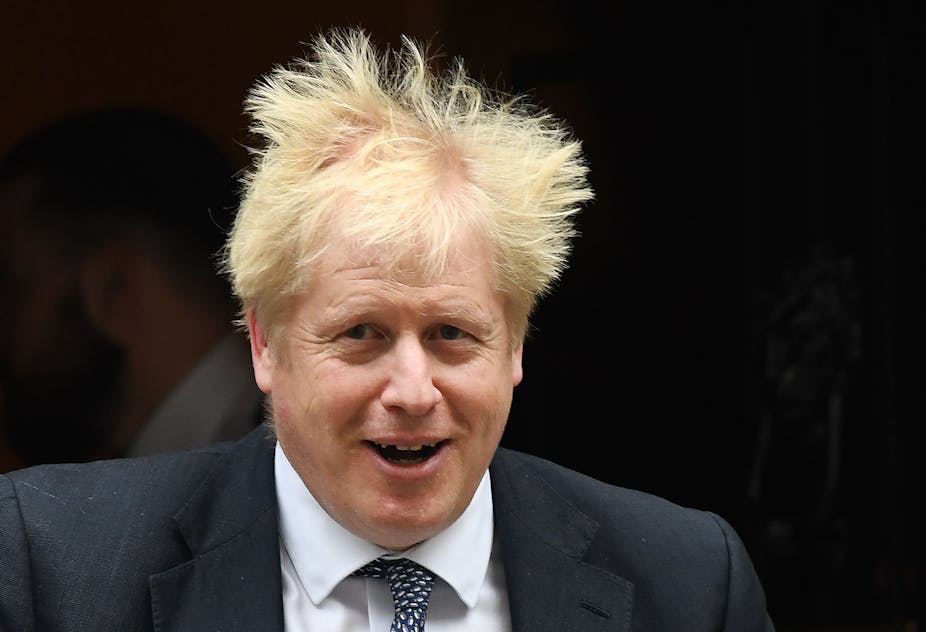 Boris Johnson leaving Downing Street with his hair in a mess.
