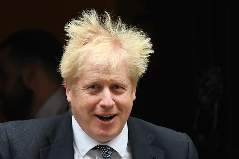 Boris Johnson leaving Downing Street with his hair in a mess.