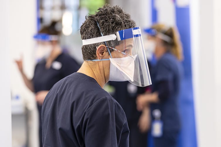 Hospital emergency departments are under immense pressure. what to know before you go nurse in ppe