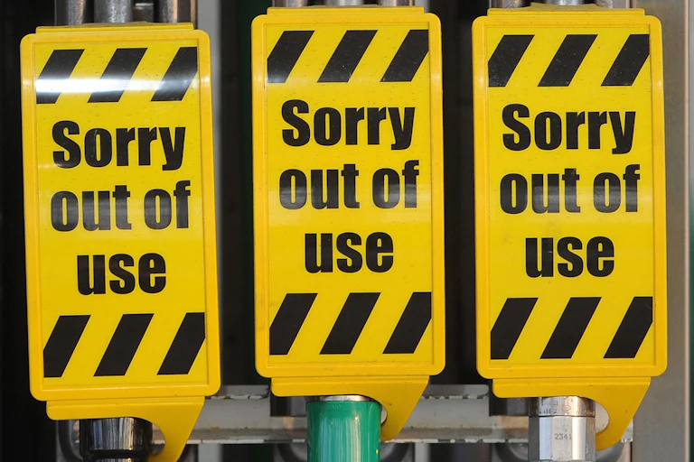 Petrol pumps with out of use signs on them