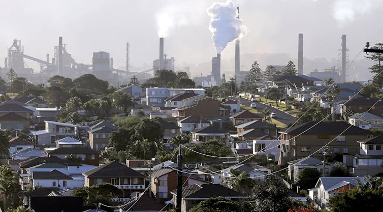 suburban scene with smoke stacks