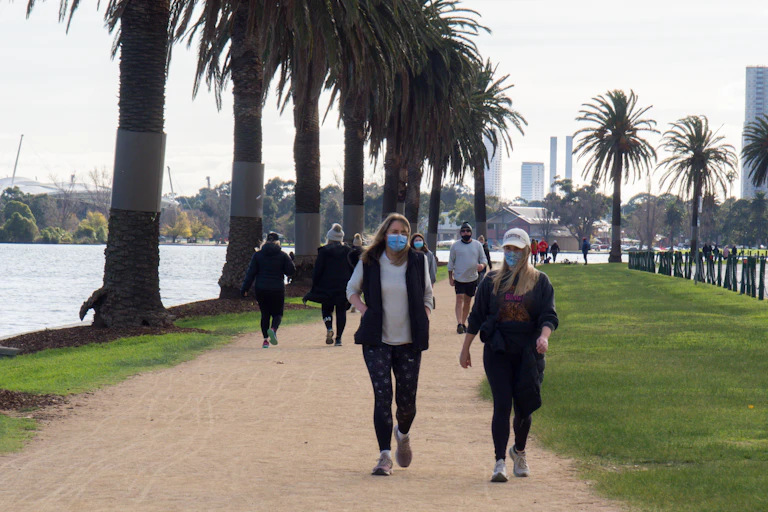 people walking with masks on