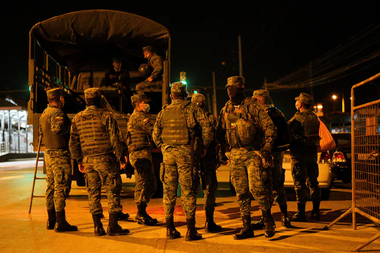 Members of Ecuador's military arrive in a truck outside the Litoral Prison in Ecuador.