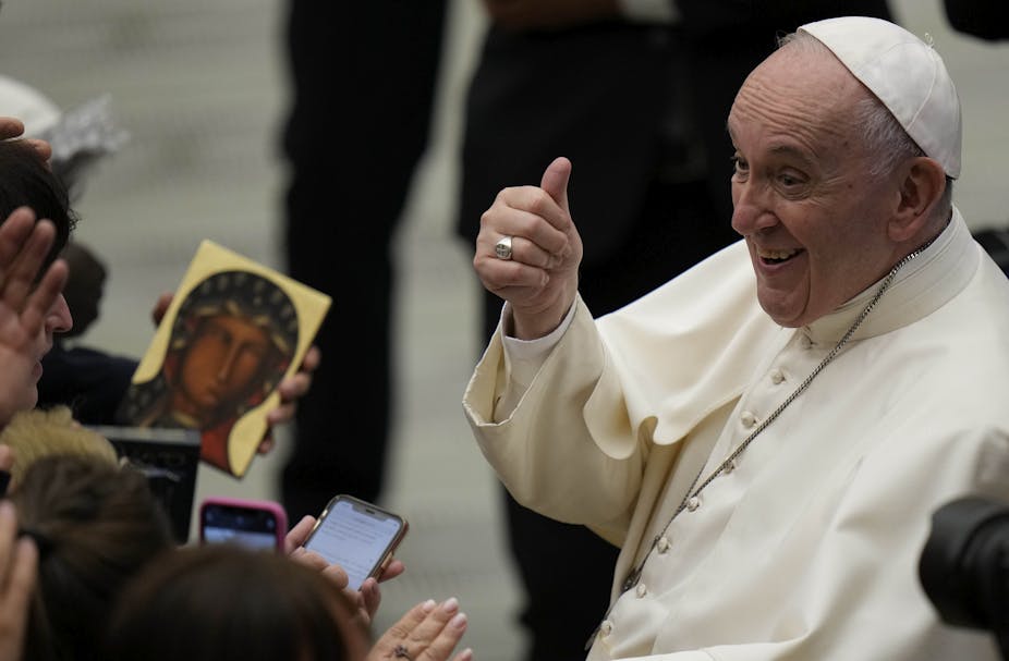 Pope Francis gives the thumbs up to listeners as he leaves his weekly general audience at the Vatican, on Sept. 22, 2021.