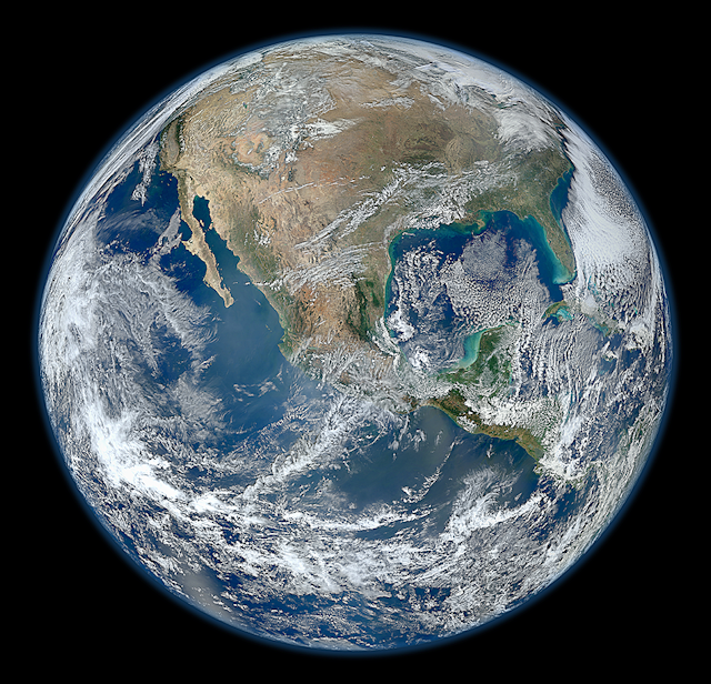 A satellite photo of Earth showing clouds over North America.