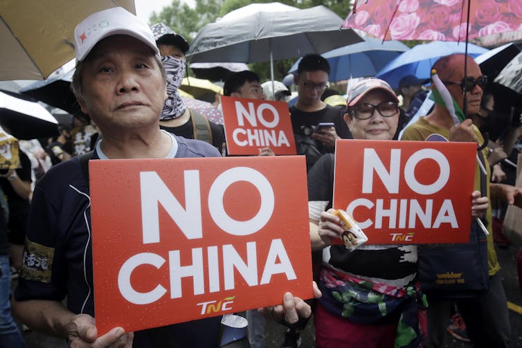 A march in Taipei against totalitarianism.