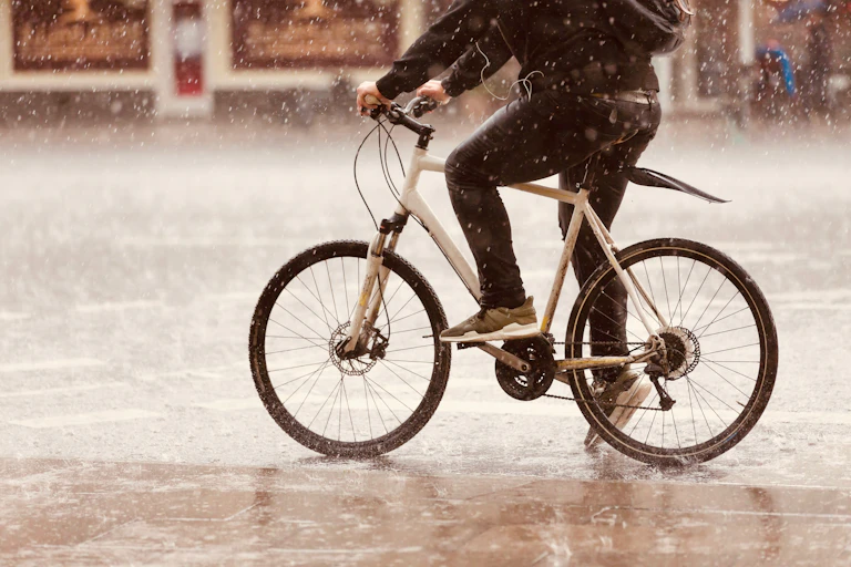 bottom half of cyclist in rain