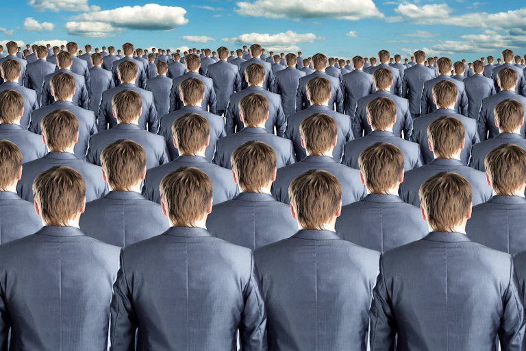 Large group of identical suit-wearing men seen from behind