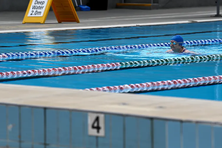 A woman swims in a pool