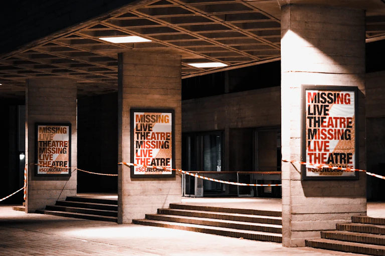 Posters read 'missing live theatre'