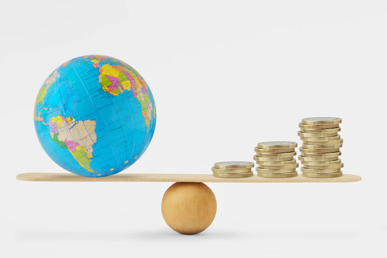 Illustration of a balance with the world on one side and money on the other.