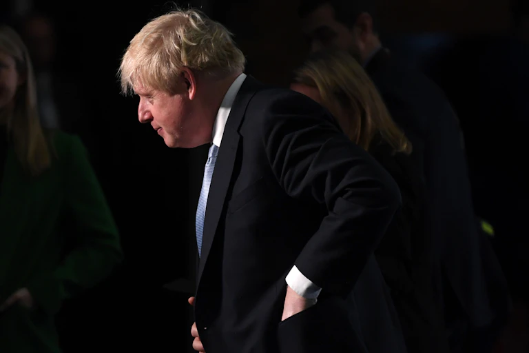 Boris Johnson against a black background