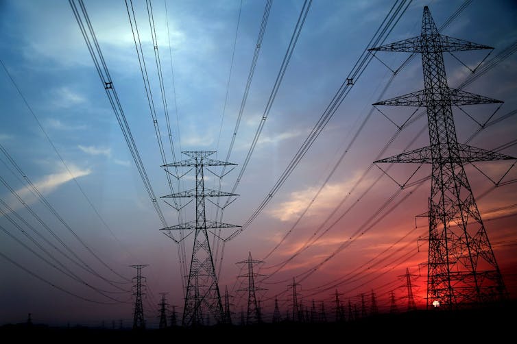 Electricity pylons at sunset