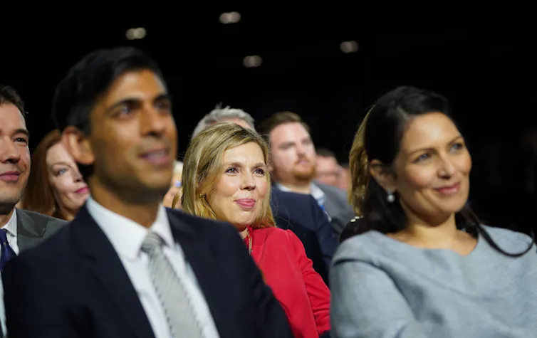 Rishi Sunak, Carrie Johnson and Priti Patel watching Boris Johnson's speech.