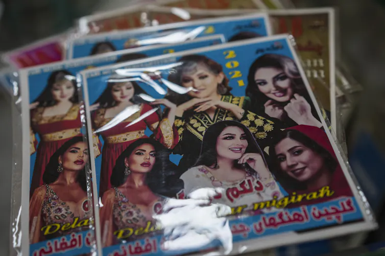DVDs of female Afghan singers sit in a shop in Kabul, Afghanistan