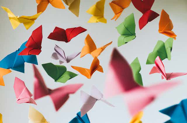 many colorful origami butterflies