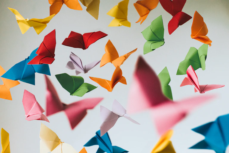 many colorful origami butterflies