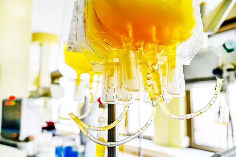 Blood plasma bags ready for infusion in hospital