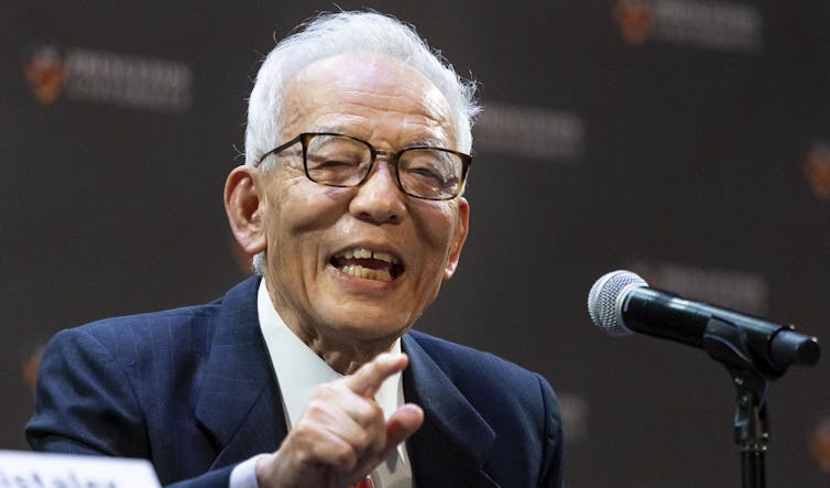 Happy old man with microphone