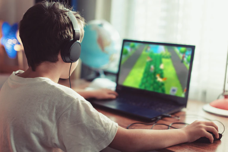 boy on computer playing game