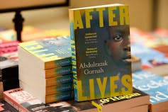 Copies of Afterlives by Tanzanian-born novelist Abdulrazak Gurnah. Photo by TOLGA AKMEN/AFP via Getty Images