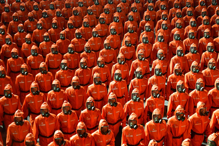 Soldiers in hazmat suits marching to celebrate the 73rd anniversary of the founding of the Democratic People's Republic of North Korea