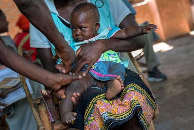 Child being vaccinated in Africa