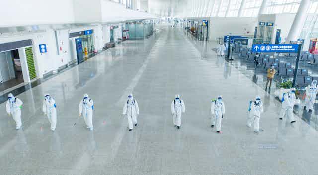 Firefighters conducting disinfection at the Terminal 3 of Wuhan Tianhe International Airport.