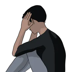 Teen boy with his head in his hands.