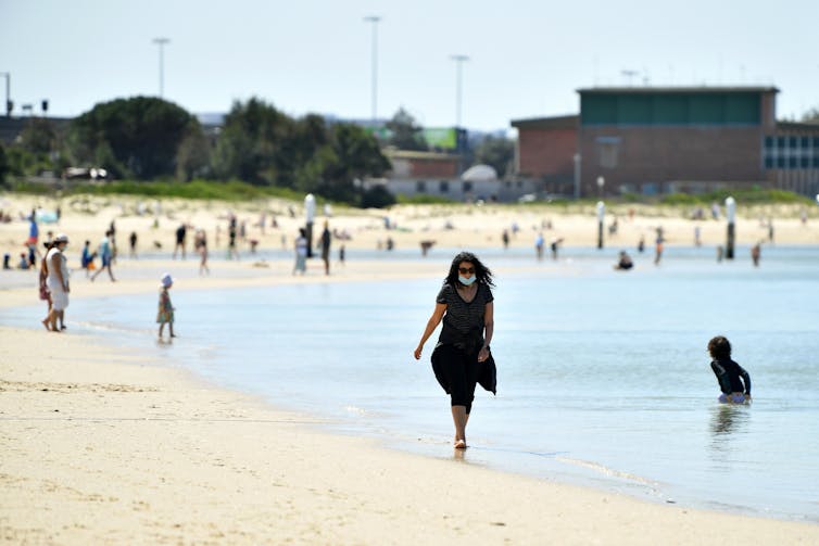Woman walking along a beach
