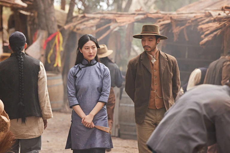 Production image: a Chinese man and woman walk together