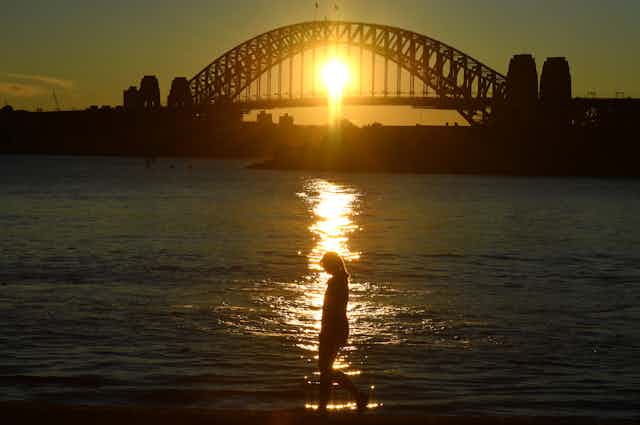 Woman walking by herself around Sydney Harbur