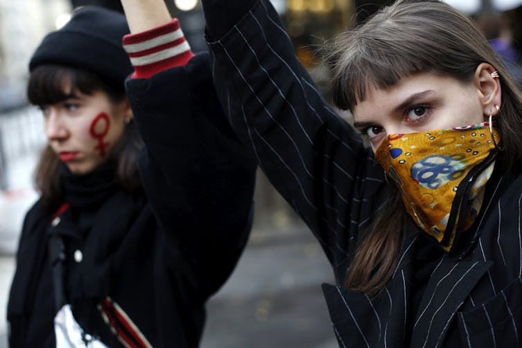 Two women at an anti-domestic violence march.