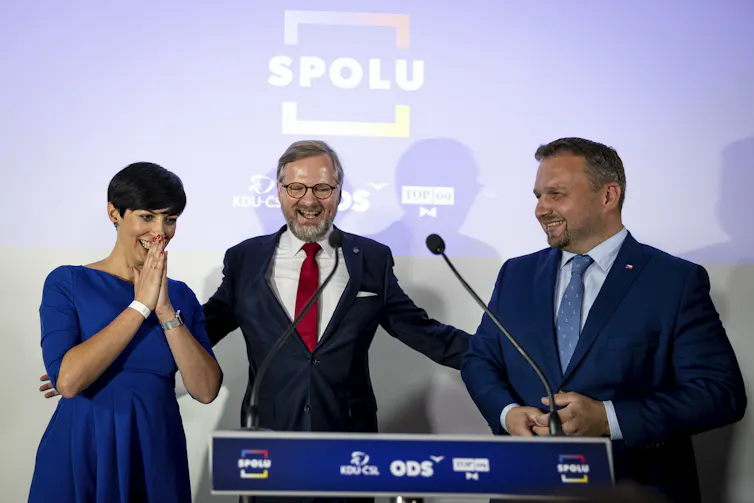Leaders of the opposition parties look shocked as they give a joint press conference.