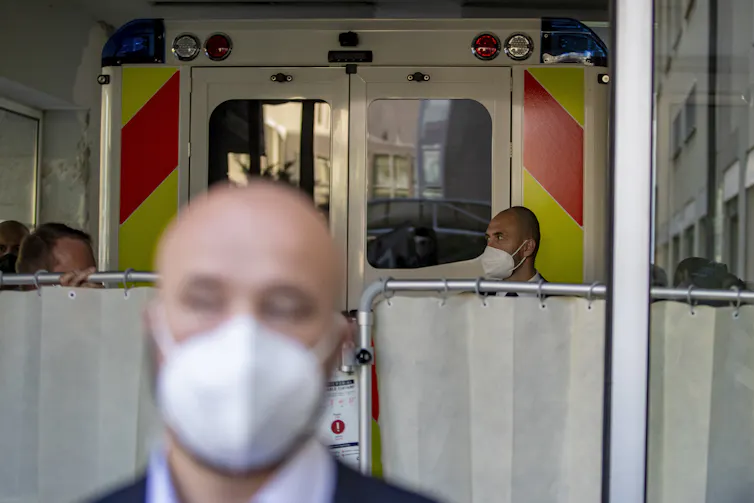 An ambulance carrying Milo Zeman arrives at a military hospital in Prague.