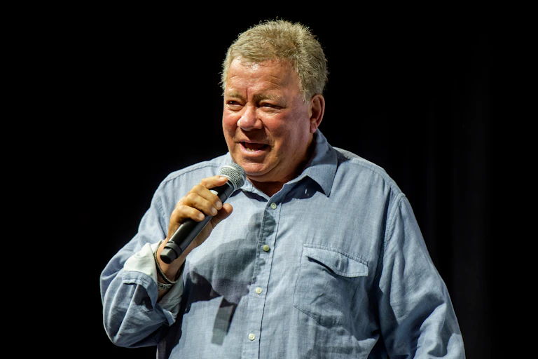 William Shatner speaking, against a black background.