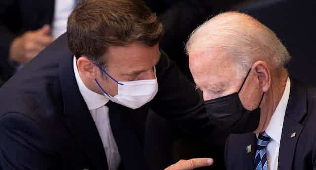 Emmanuel Macron talks to Joe Biden