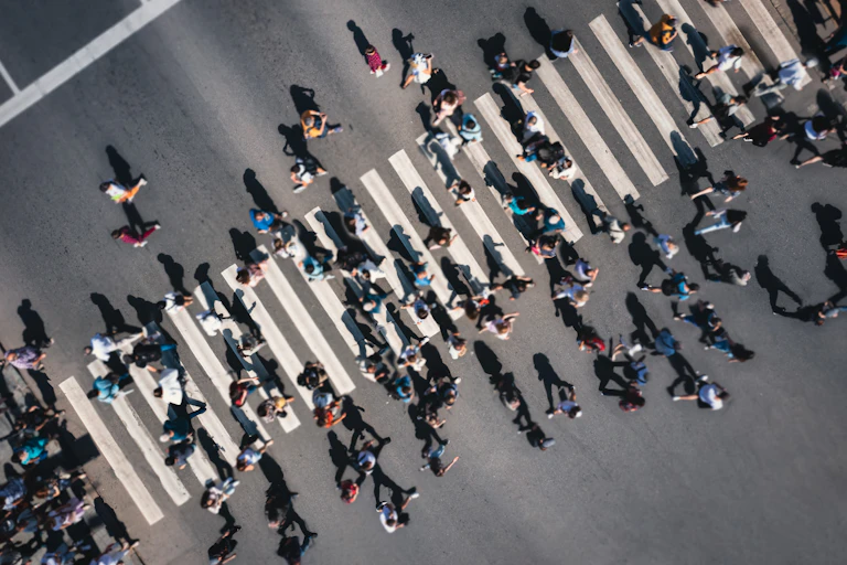 Aerial shot of lots of people crossing a road