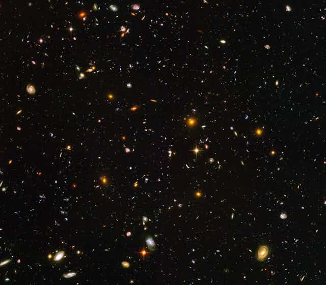 A picture of thousands of galaxies in space.
